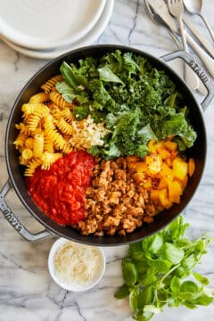 Pasta dish made from crumbled Italian sausage, fusilli pasta, torn kale, bell pepper and marinara sauce.